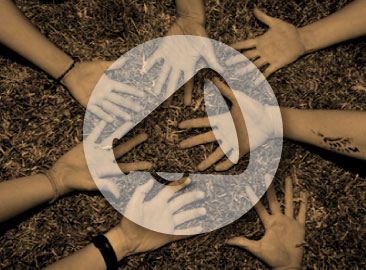 Photo of people joining hands in a ciricle with orange overlay and a megaphone graphic