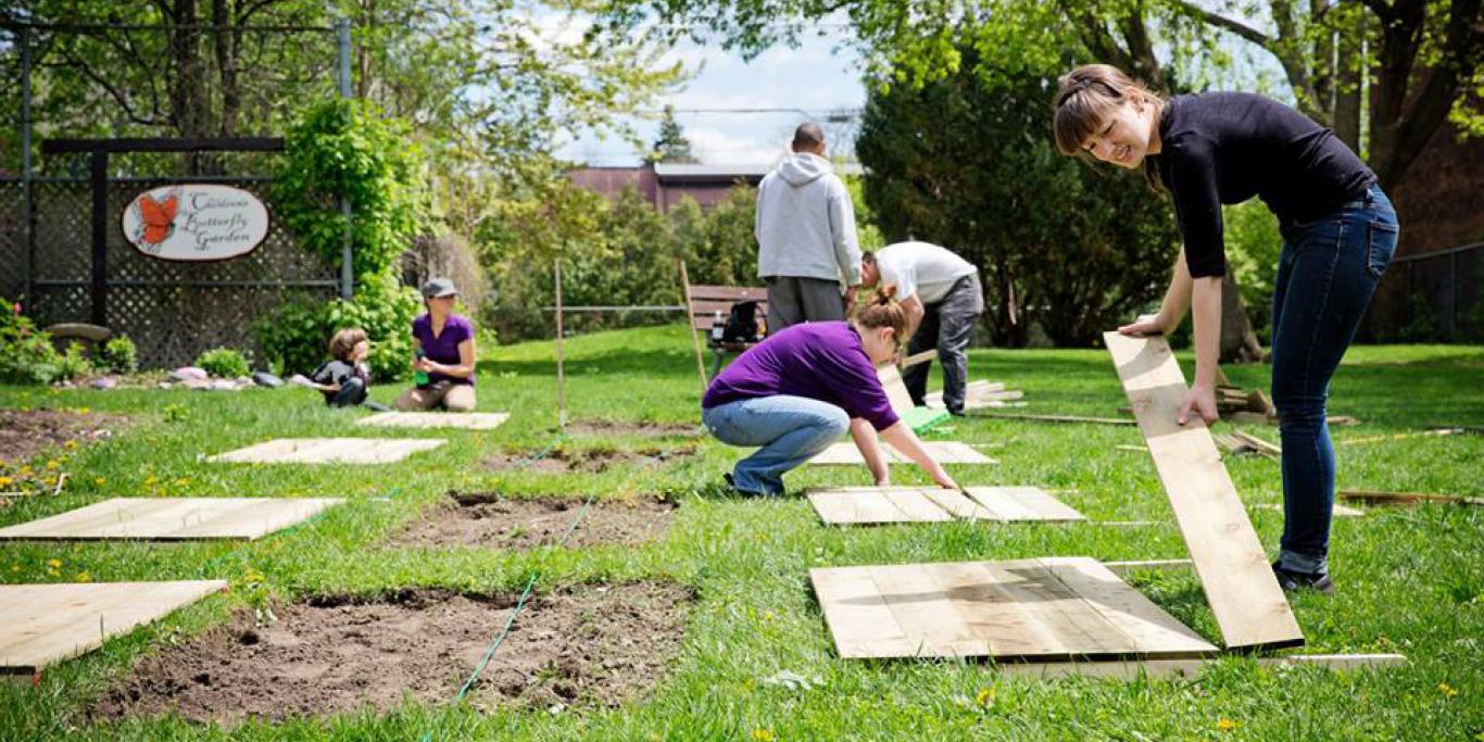 Community gardeners building raised beds